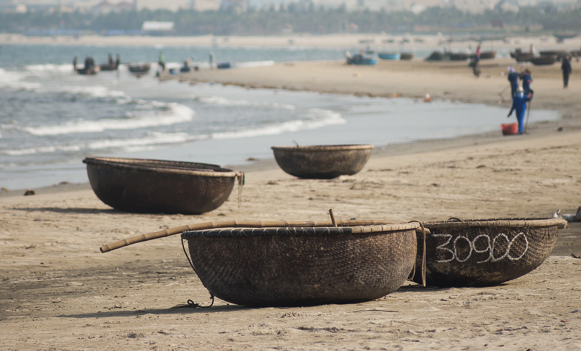 Round bamboo basket boats (coracles) pulled up on the sand near Da Nang